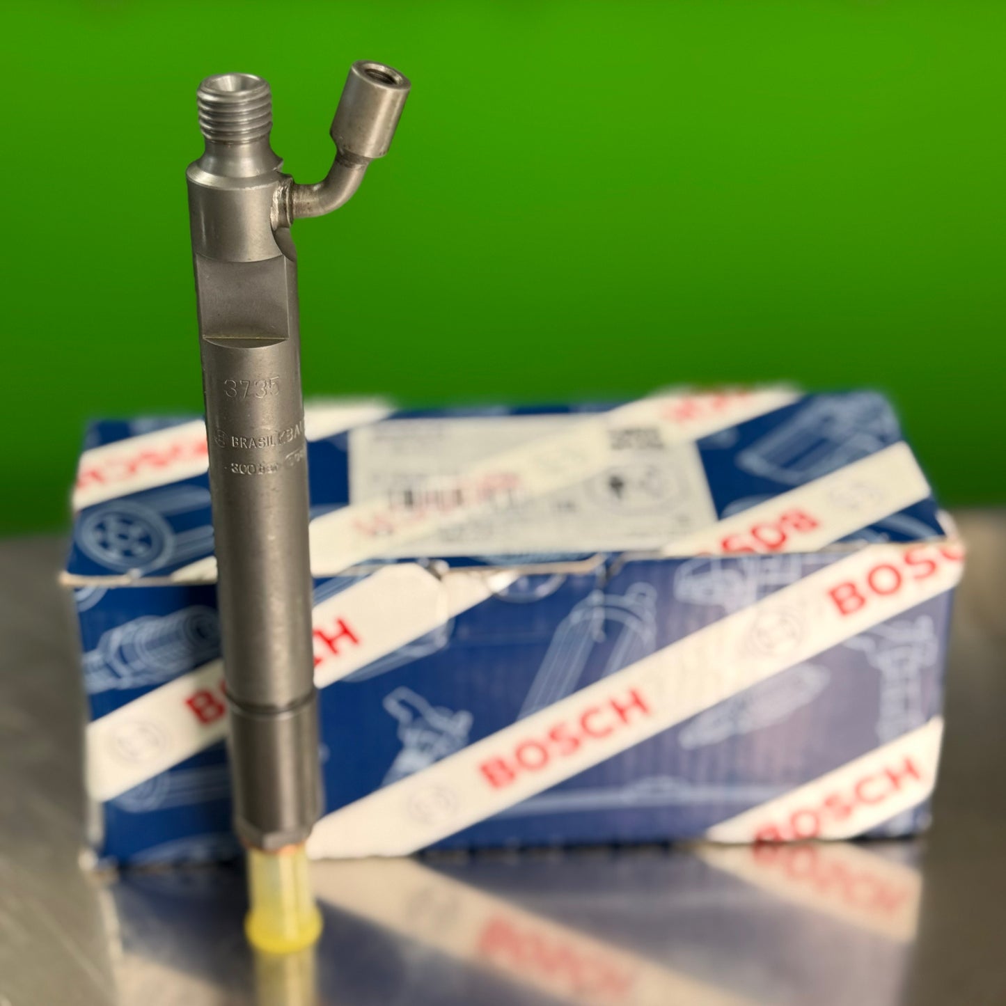 0432191756 bosch fuel injector angled view with protective cap and bosch packaging