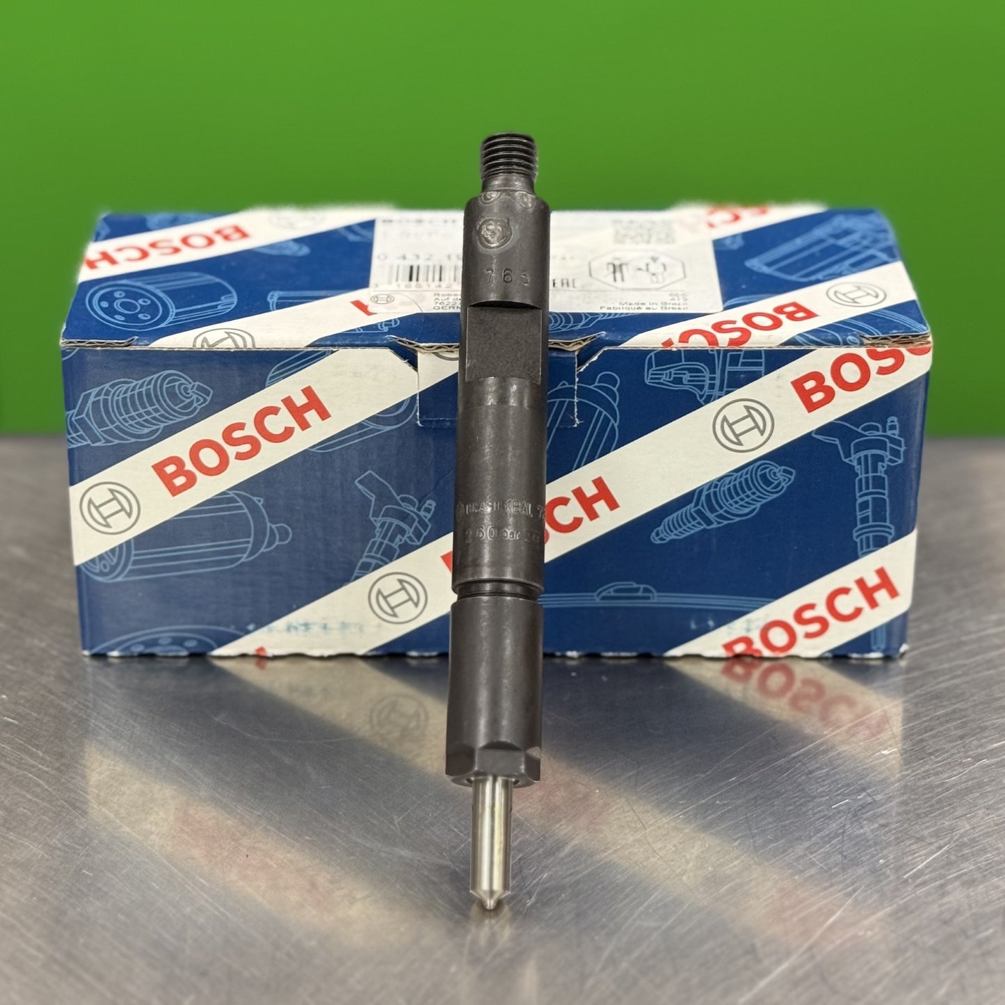 Bosch automotive part on a metallic surface with a green background