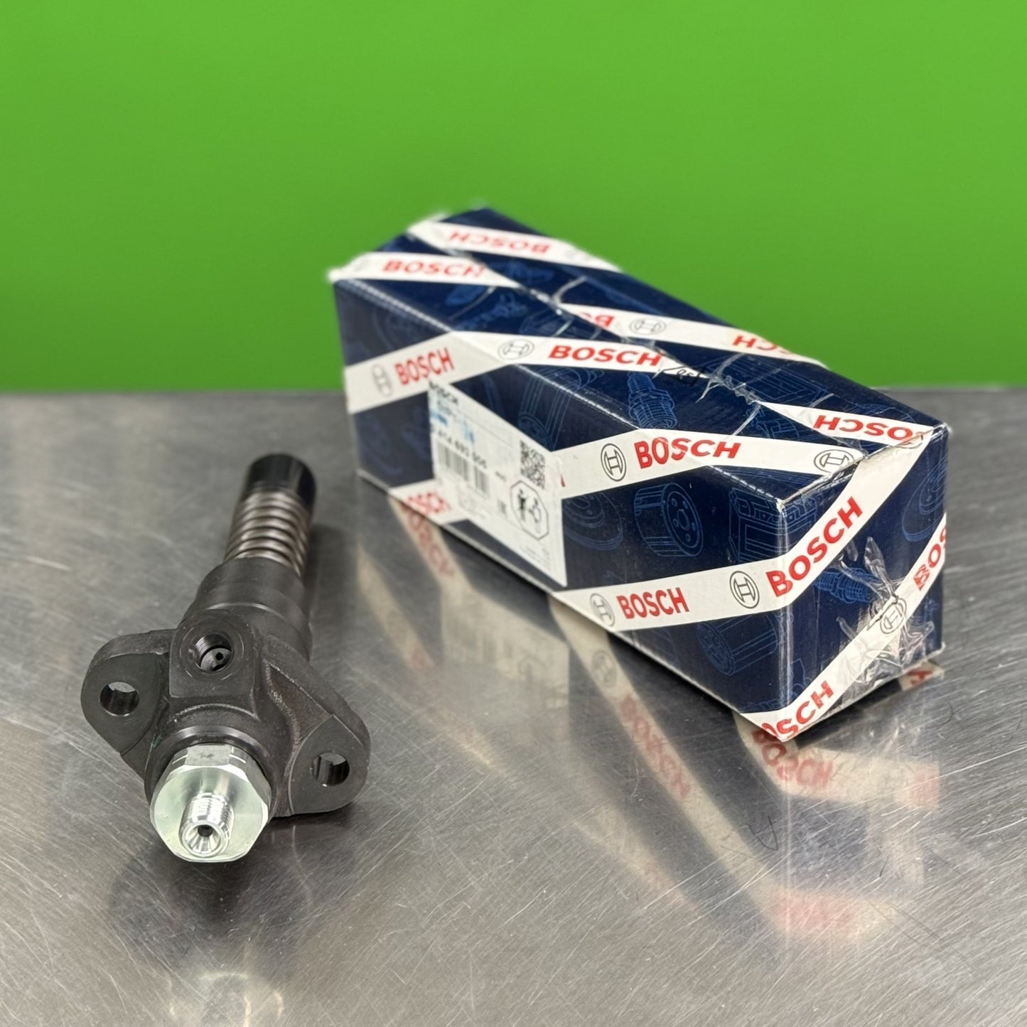 Bosch 0414693005 fuel injection pump showing fuel outlet ports and line connection detail