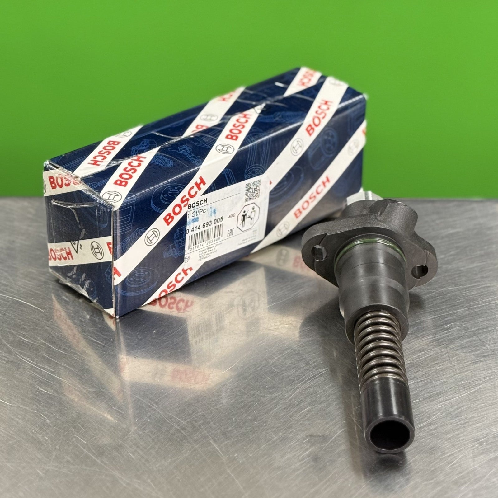 Close-up of Bosch diesel injection pump 0414693005 showing fittings and precision components