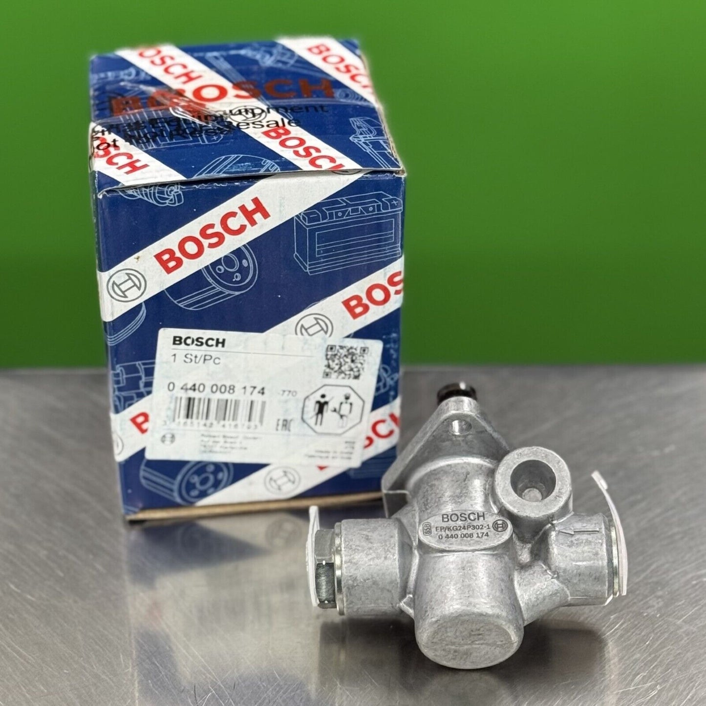 Side view of Bosch 0440008174 diesel fuel supply pump showing inlet and outlet ports