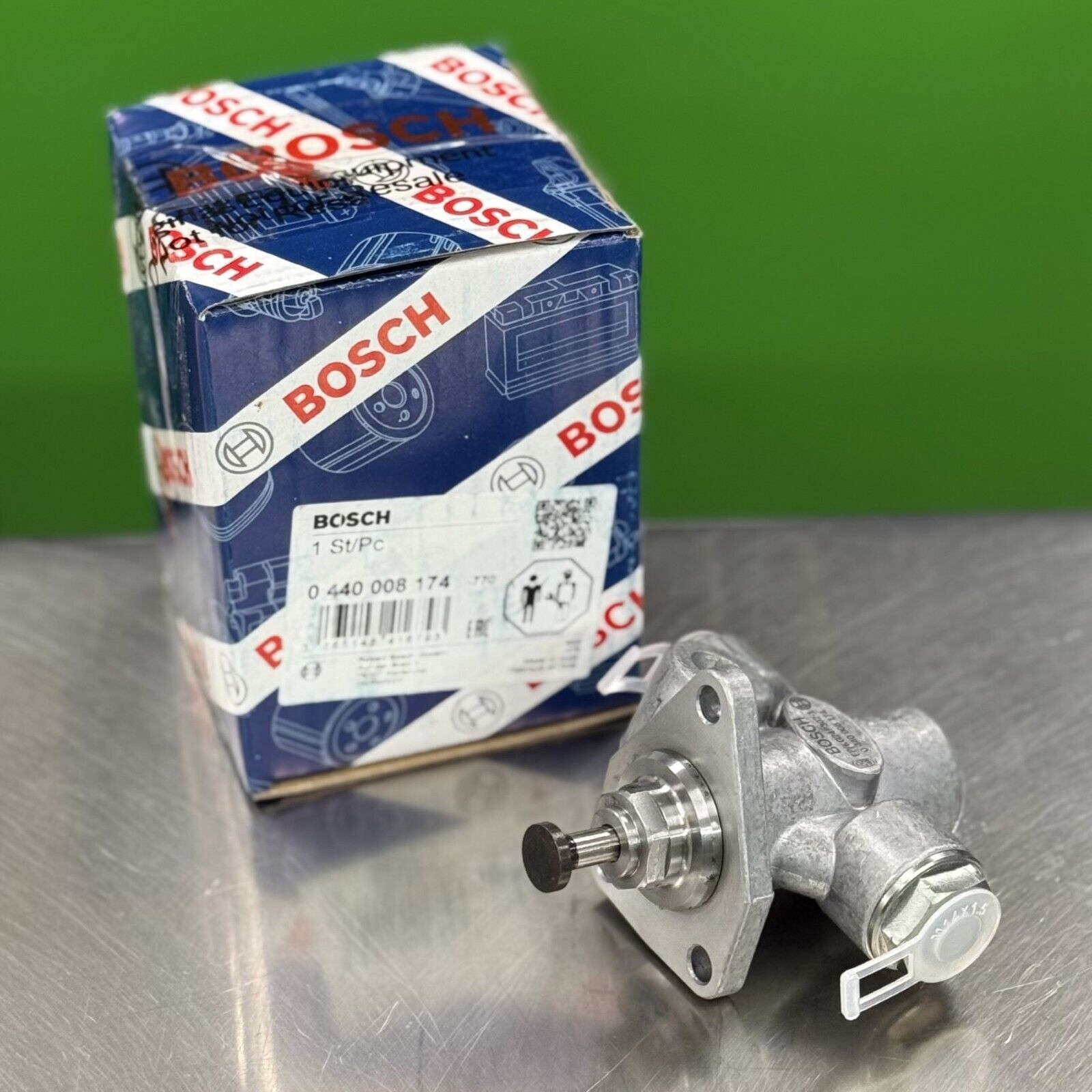 Top view of Bosch lift pump 0440008174 showing fuel line connections and mechanical housing