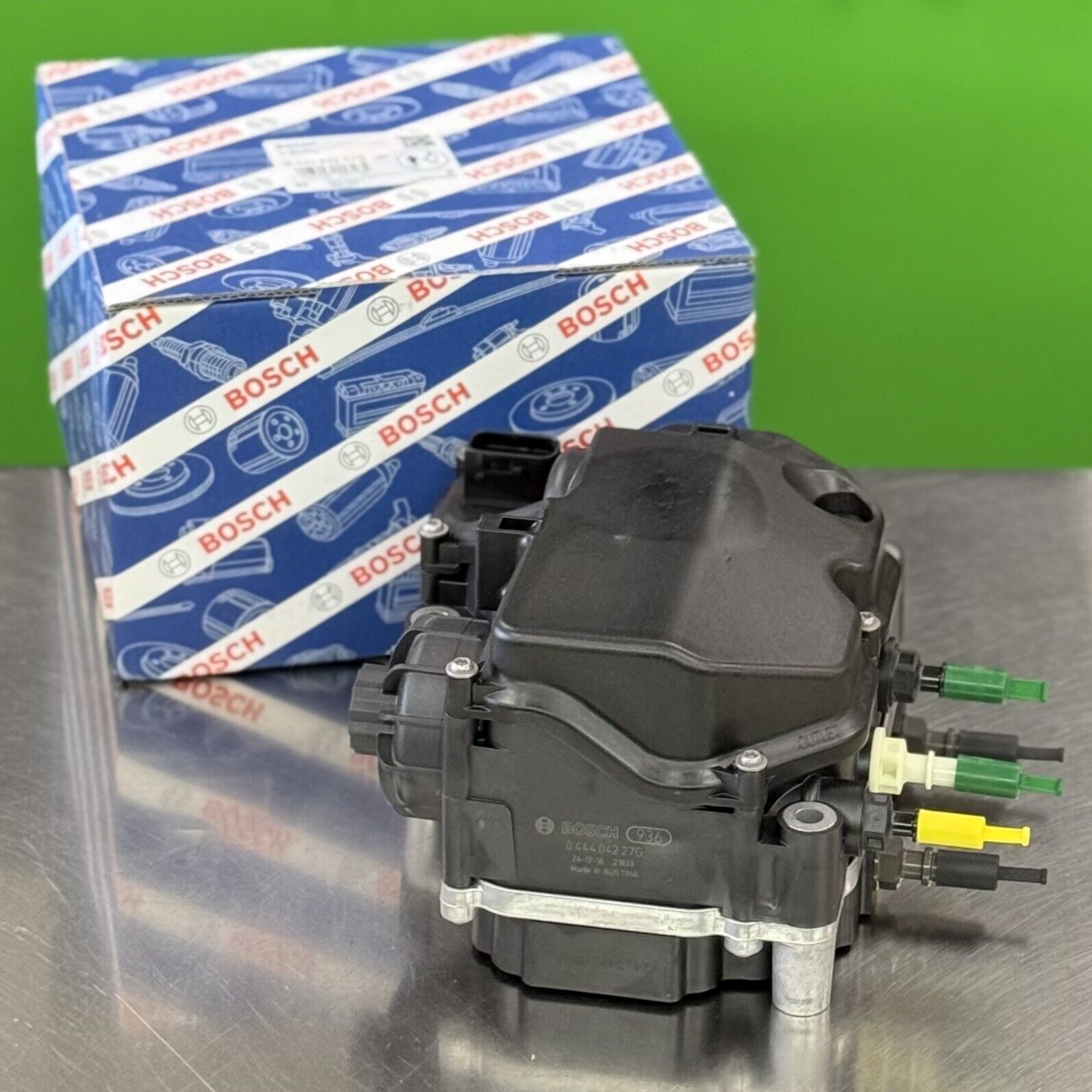 Bosch 044404227G DEF doser supply module showing hose ports and fluid connections