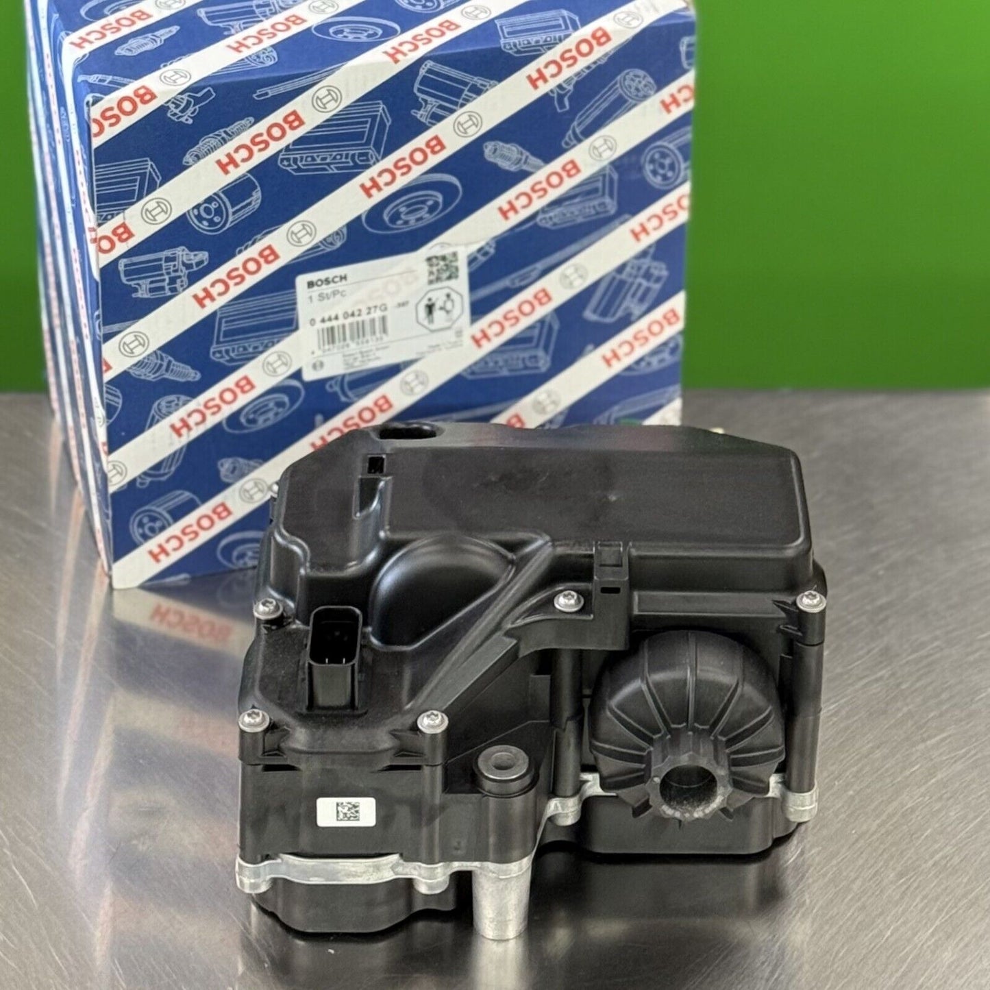 Top view of Bosch 044404227G DEF module showing electrical connector and upper housing detail