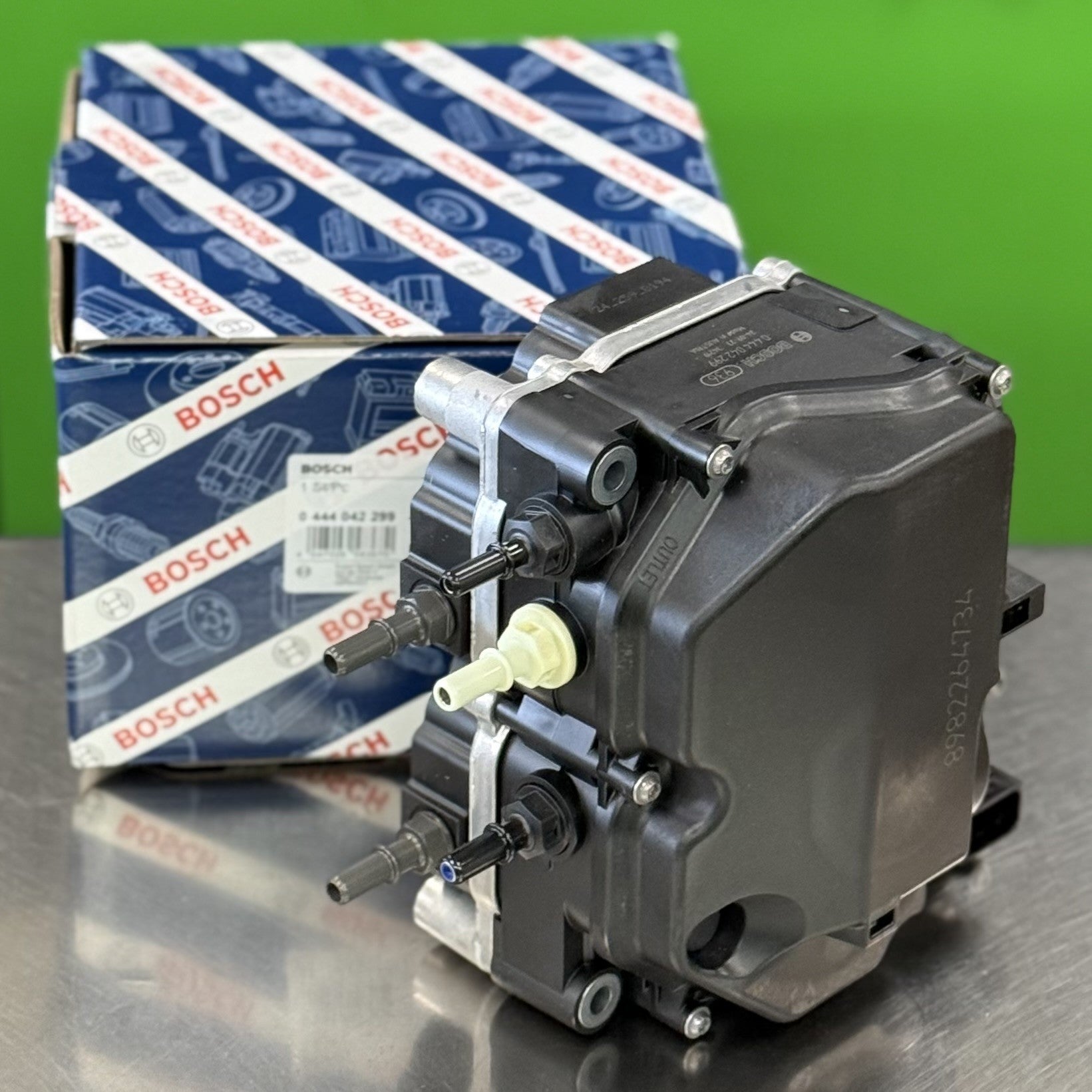 Top angle view of Bosch 0444042299 DEF supply pump for diesel exhaust fluid system