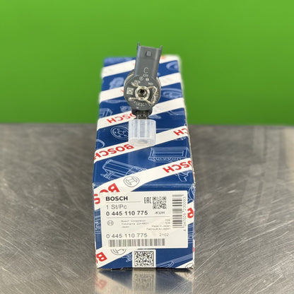 Top connection of Bosch 0445110775 fuel injector showing electrical and fuel inlet connection
