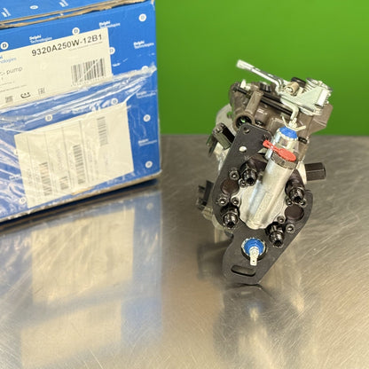 Delphi 9320A250W fuel injection pump showing fuel line outlet connections and linkage detail