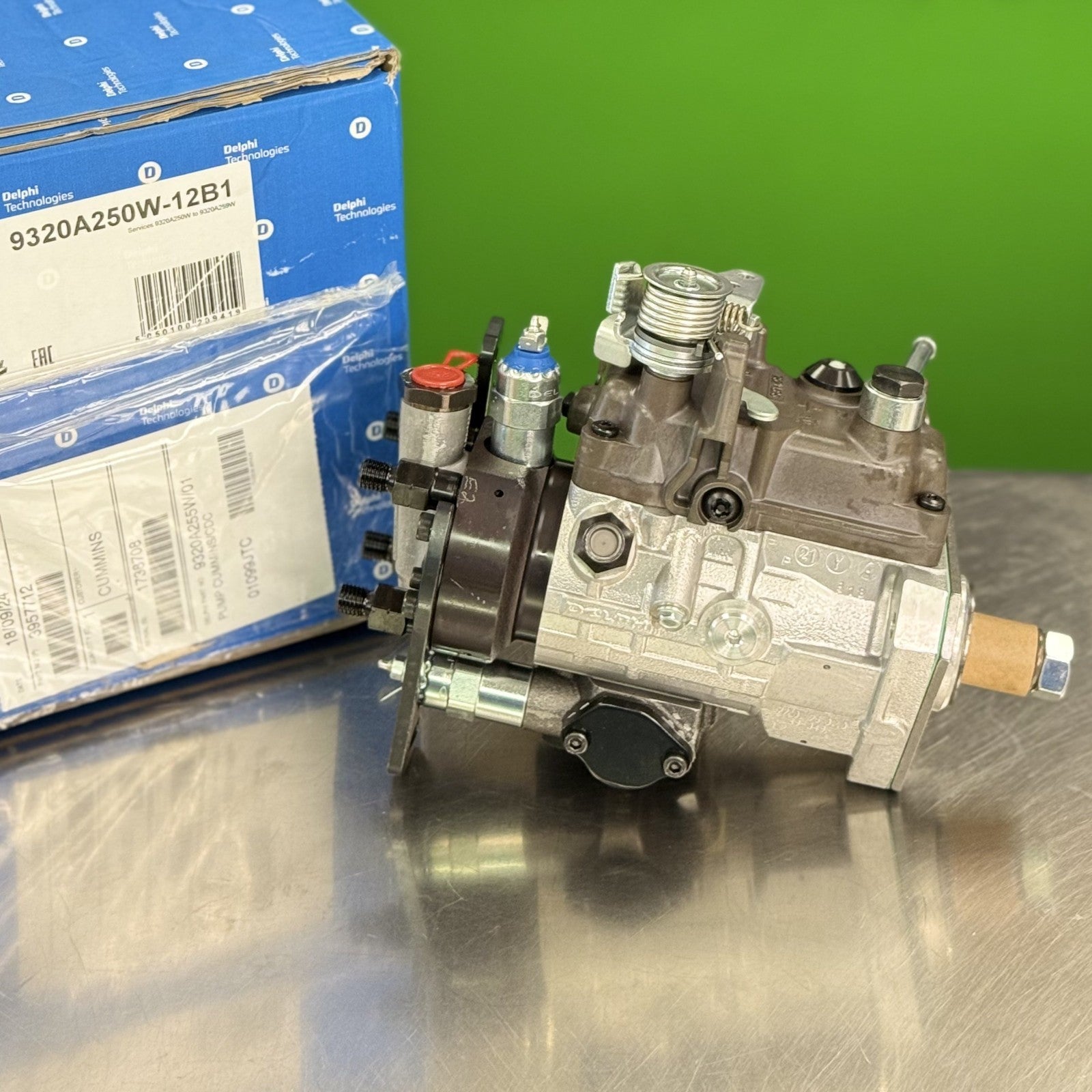 Side view of Delphi 9320A250W diesel fuel injection pump showing housing and mounting points
