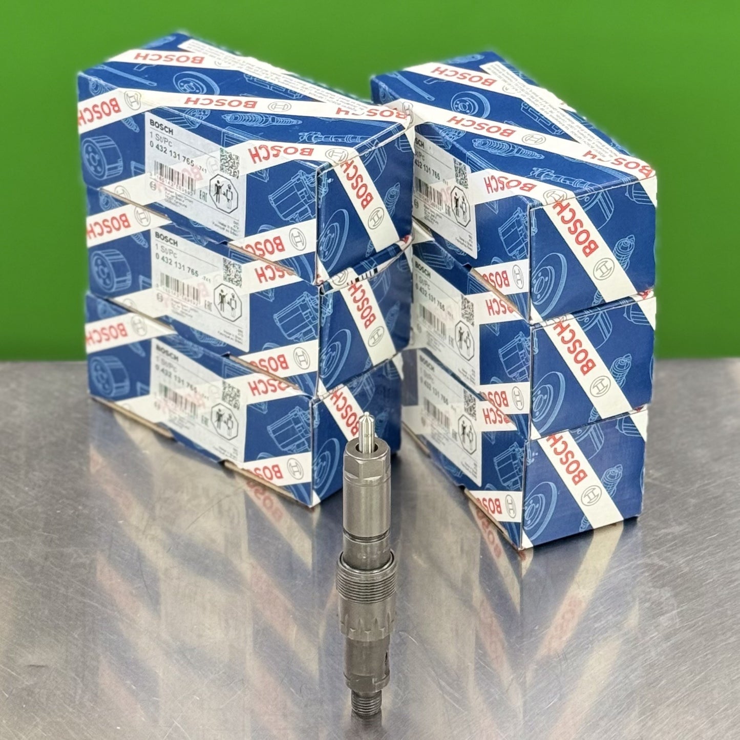 Stacks of Bosch branded boxes on a reflective surface with a green background