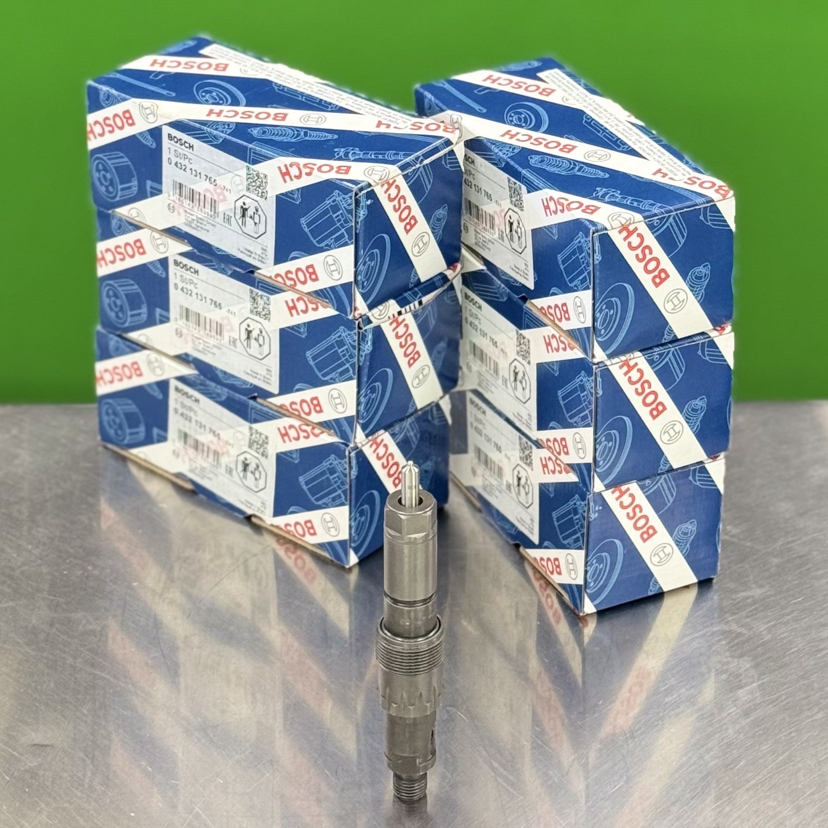 Stacks of Bosch branded boxes on a reflective surface with a green background