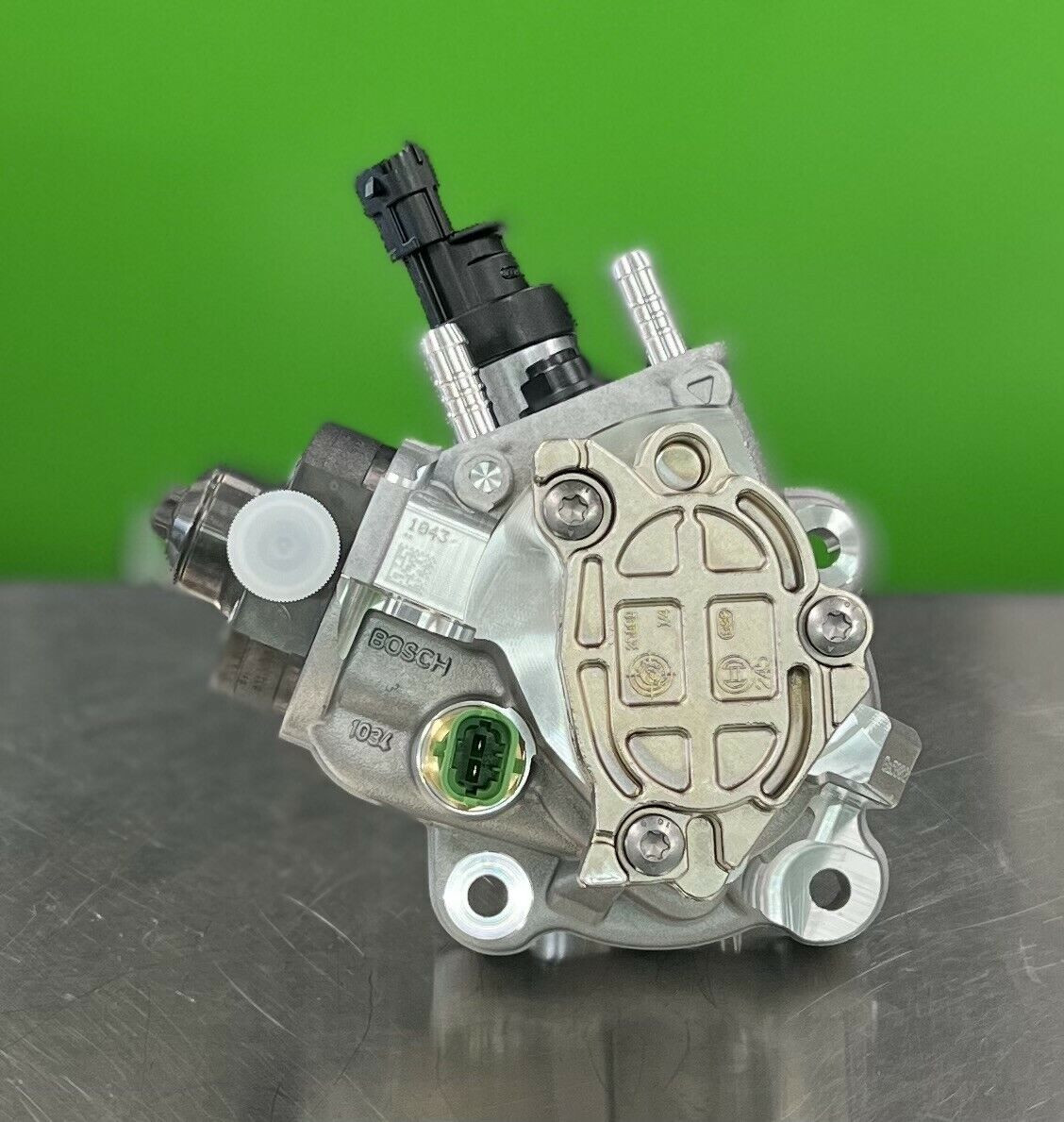Close-up of Bosch 0445020509 fuel injection pump showing precision components and fittings