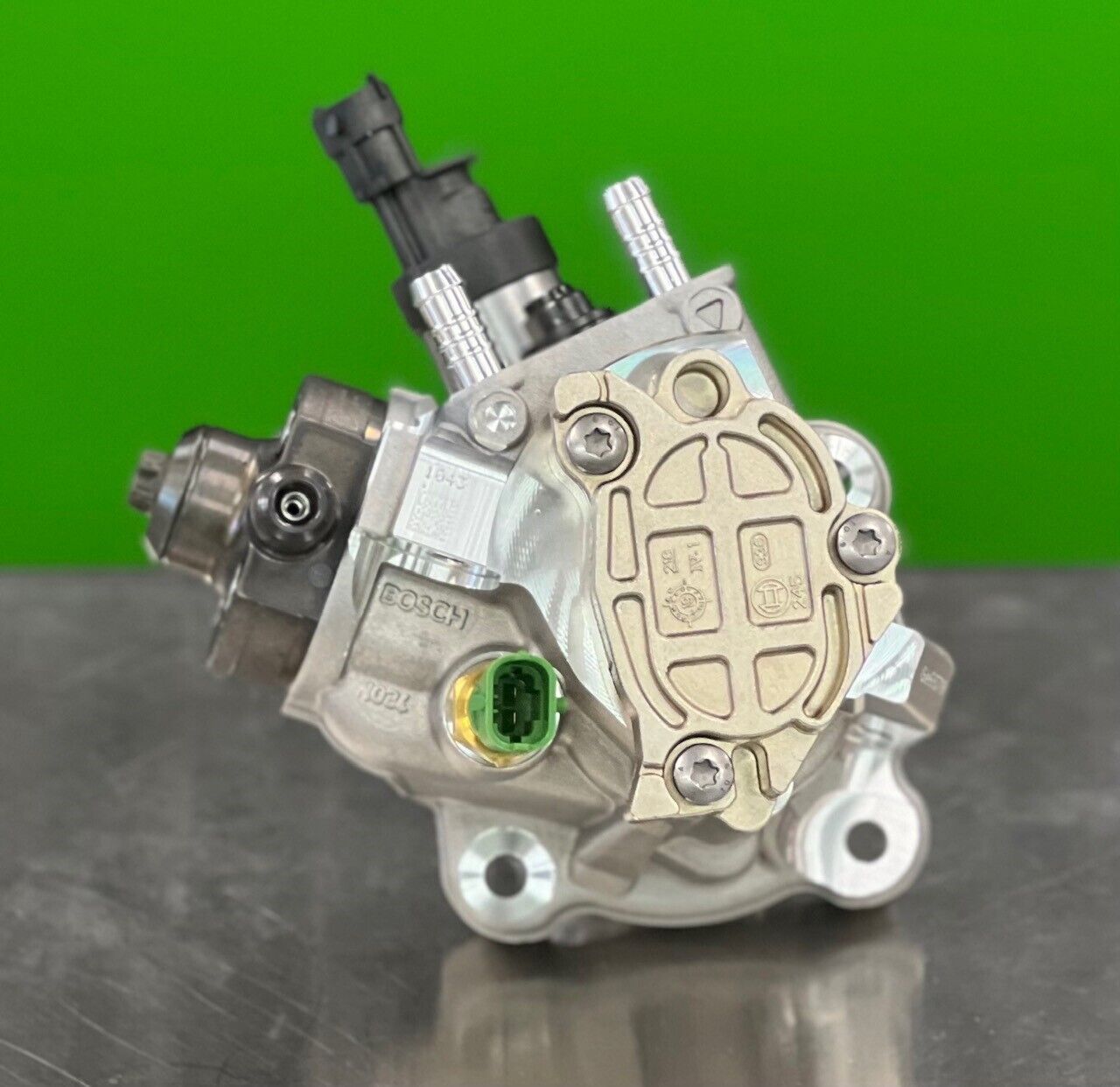 Close-up of Bosch 0445020538 fuel injection pump showing precision components and fittings 