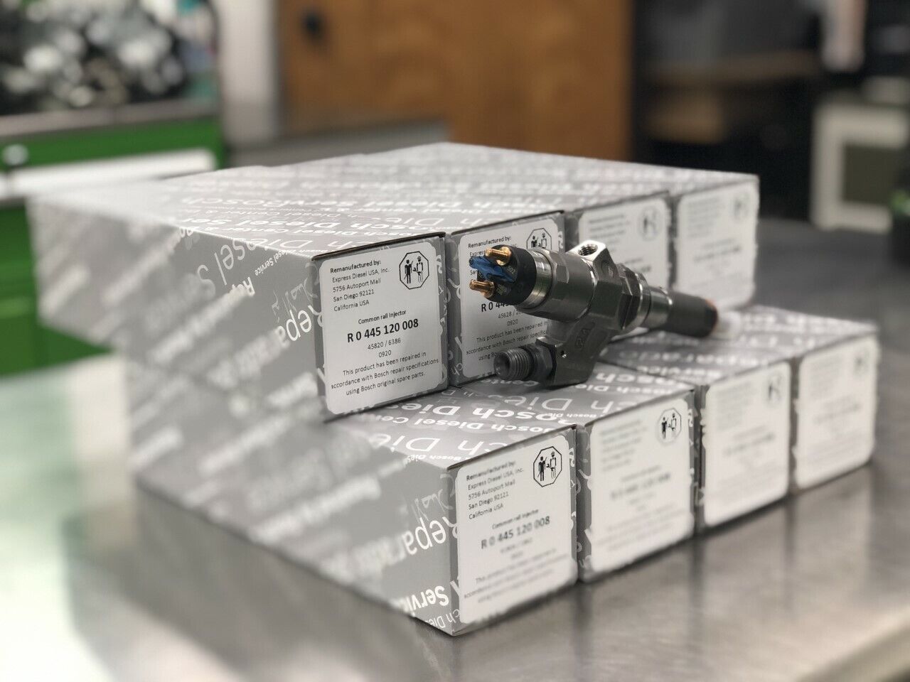 Side view of Bosch Duramax LB7 injector set showing 8 remanufactured diesel injectors